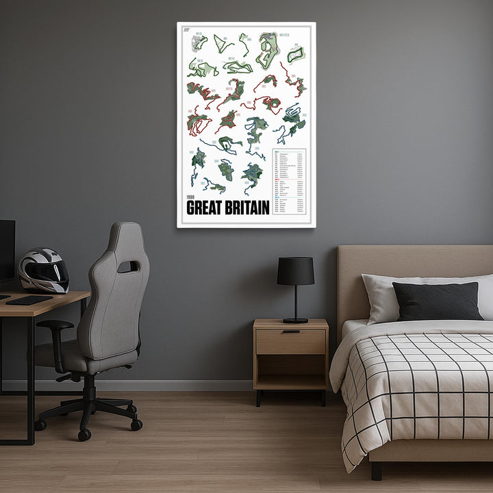 Room interior with a bed, desk, and chair, featuring a map of the 1998 Great Britain Rally on the wall.