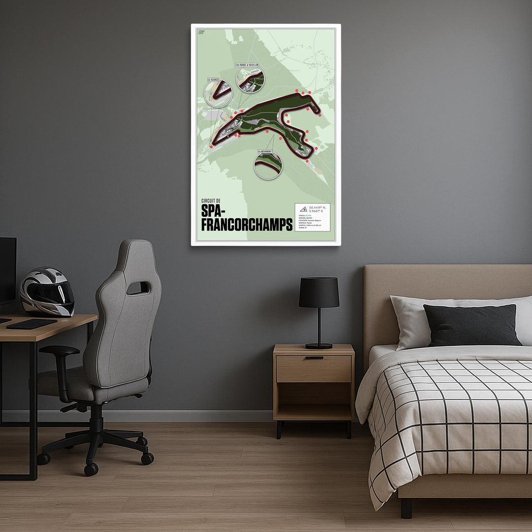 Room interior with a bed, desk, and chair, featuring a hanging artwork of Spa-Francorchamps on the wall.