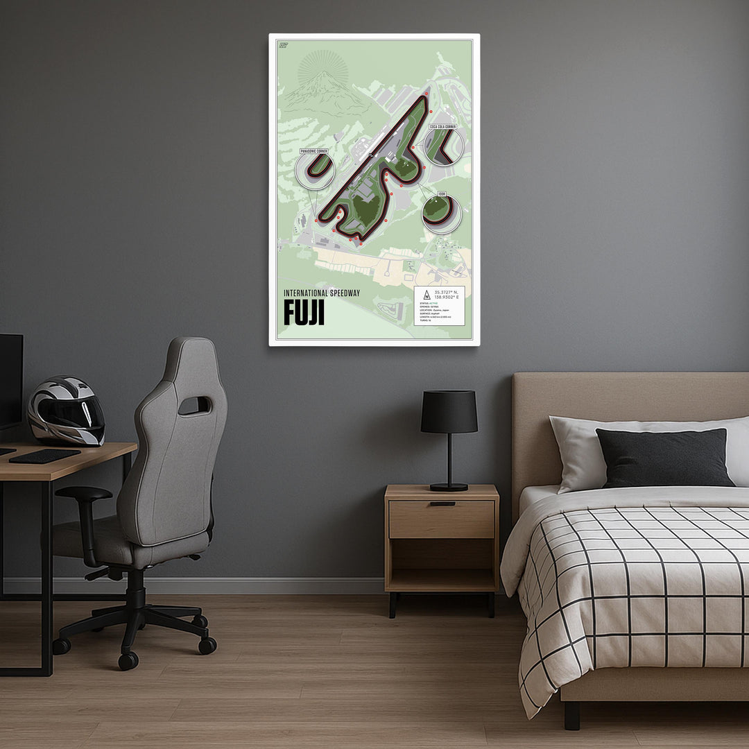 Room interior with a bed, desk, and wall art of Fuji Speedway.