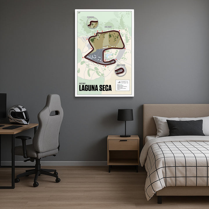 Room interior with a bed, desk, and chair, featuring a framed map of Laguna Seca on the wall.