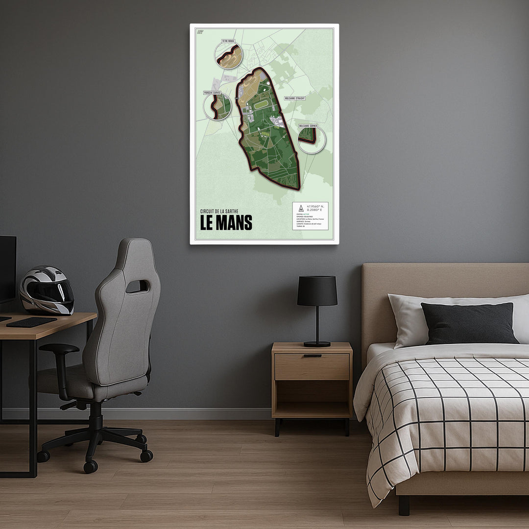 Room interior with a map of Le Mans on the wall, bed, desk, and chair.