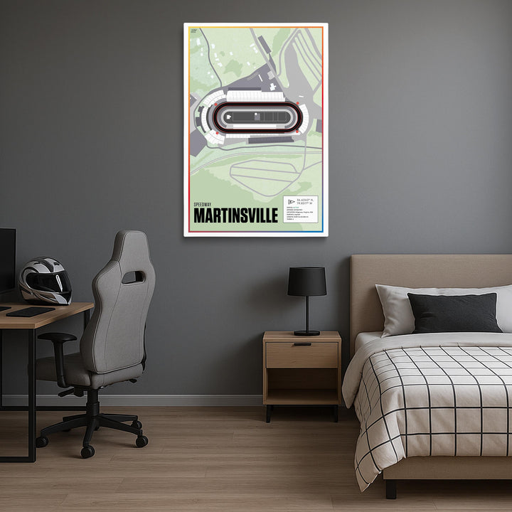 Room interior with a bed, desk, chair, and framed poster on a gray wall.