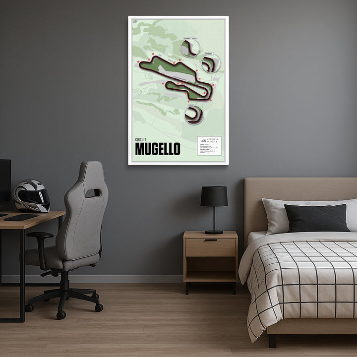 Room interior with a bed, desk, and chair, featuring a framed poster on the wall.