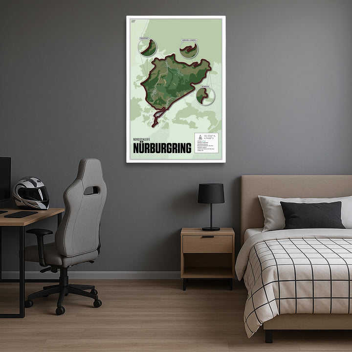 Room interior with a map of Nurburgring on the wall, bed, desk, and chair.