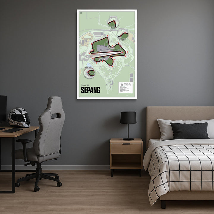 Room interior with a map of Sepang circuit on the wall, bed, desk, and chair.