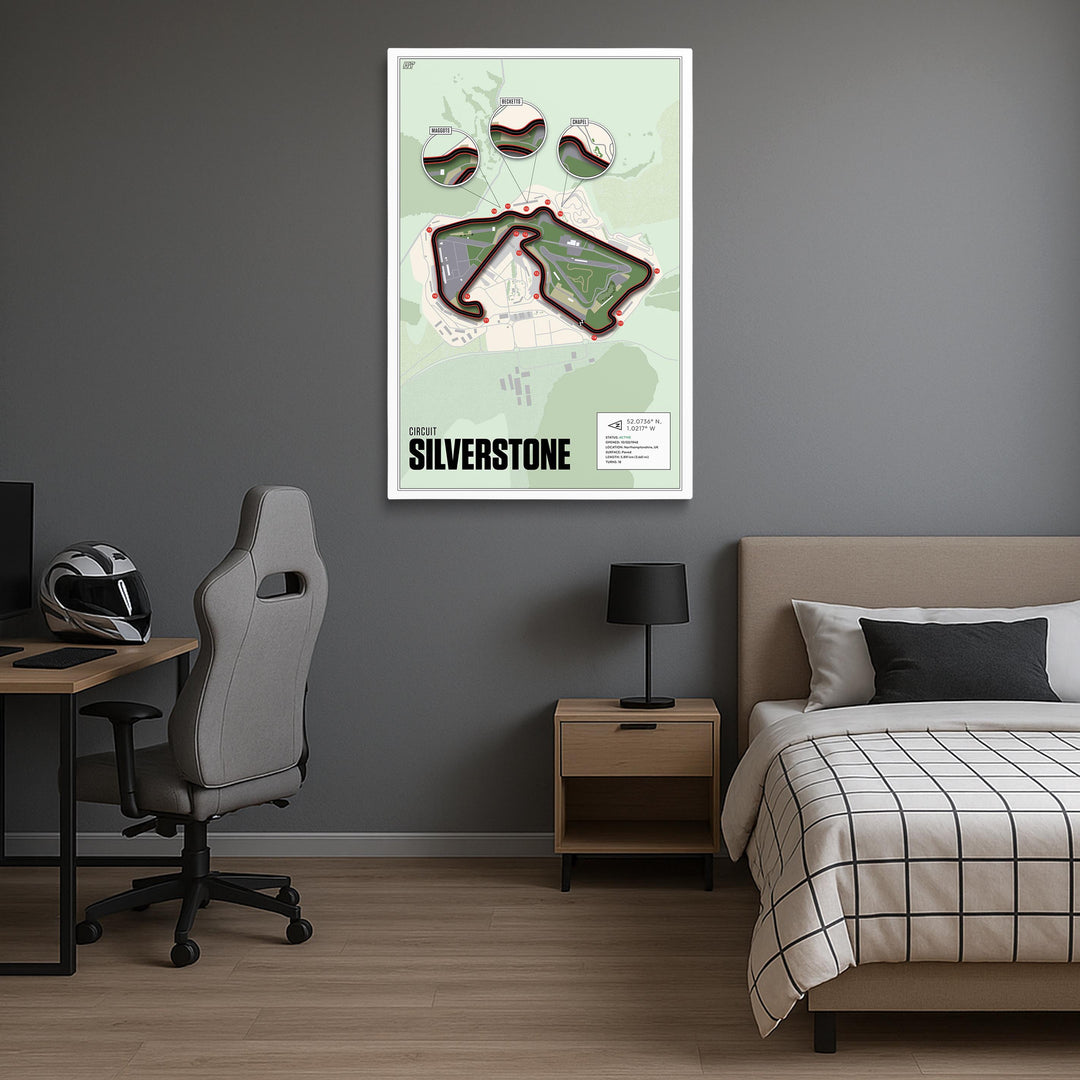 Room interior with a bed, desk, and wall art of Silverstone race track.