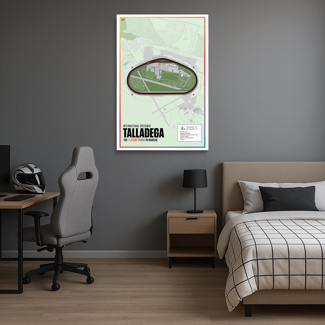Room interior with a bed, desk, and chair, featuring a framed map of Talladega on the wall.